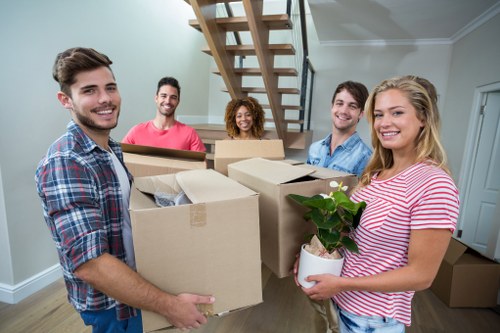 Professional packing of fragile household items for a move in Islington