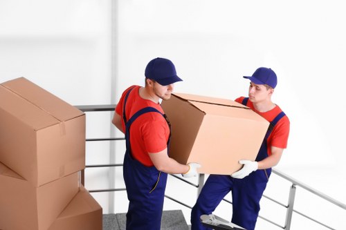 Local flat removal service handling furniture in a modern Islington apartment block